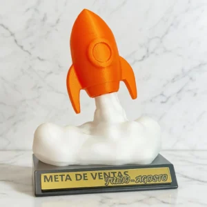 trofeo-3d-cohete-naranja-con-humo-blanco-y-base-gris-para-metas-de-ventas
