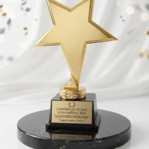 trofeo estrella metálica dorada con base en vidrio negro desde colombia